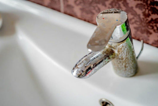 stained bathroom tap